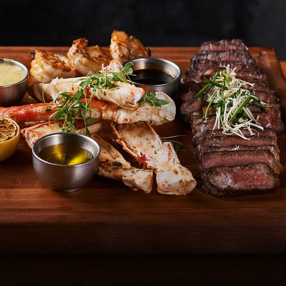 steak and lobster on cutting board - Mobile
